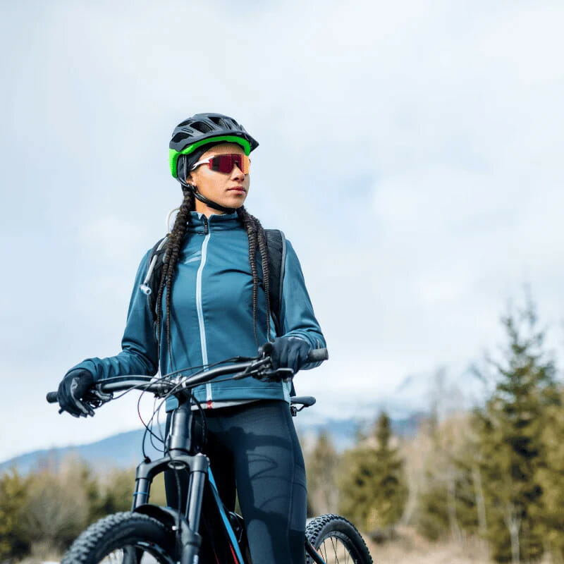 image of woman mountain biking