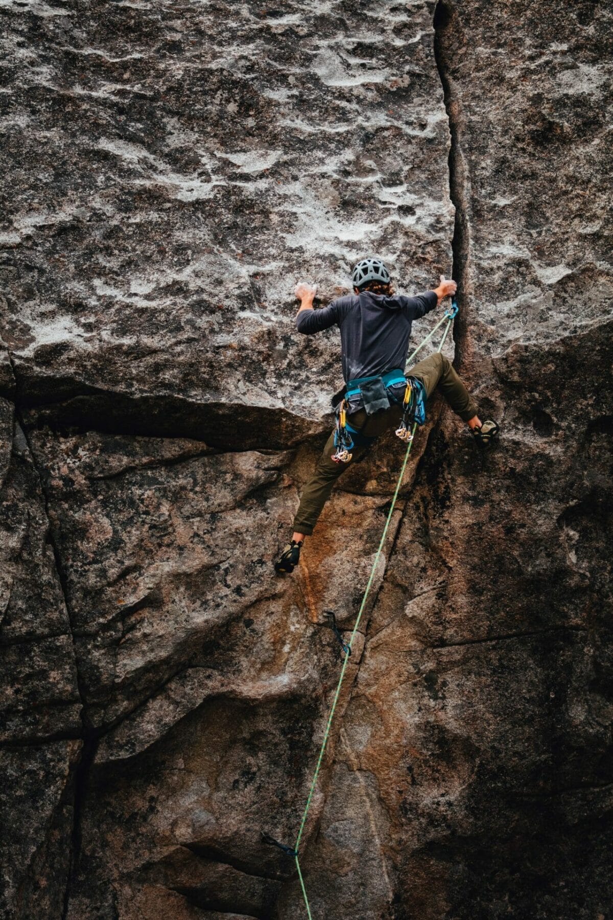 photo of a person rock climbing